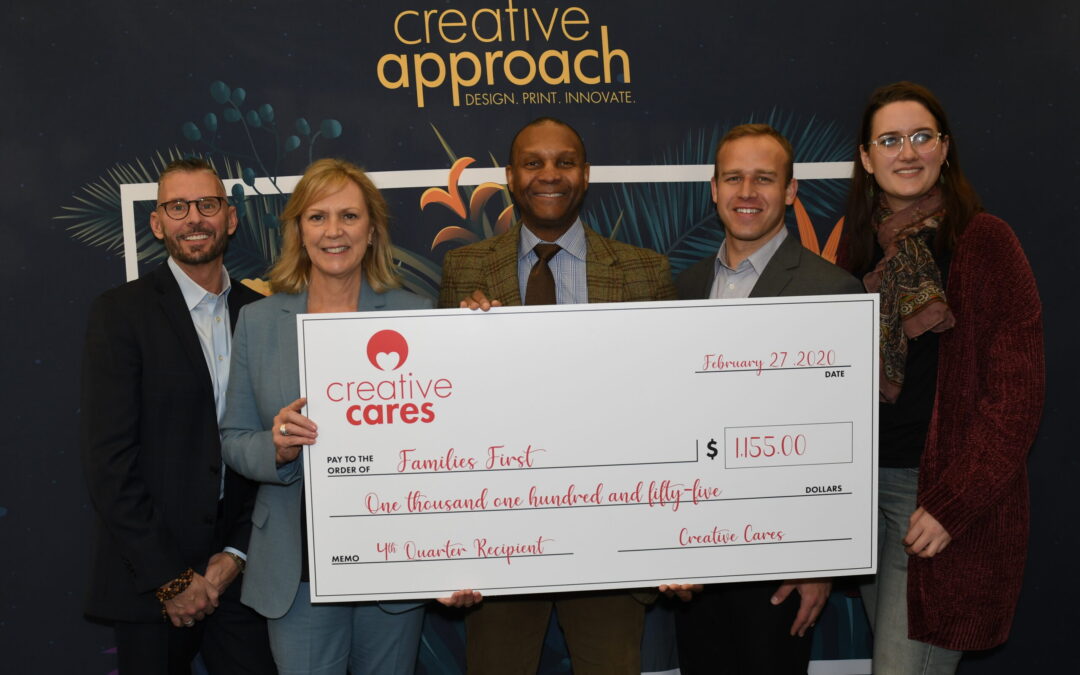 Creative Cares presents check to Families First